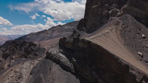 Dramatic Cliff Edge in Dry Mountain Range Aerial View