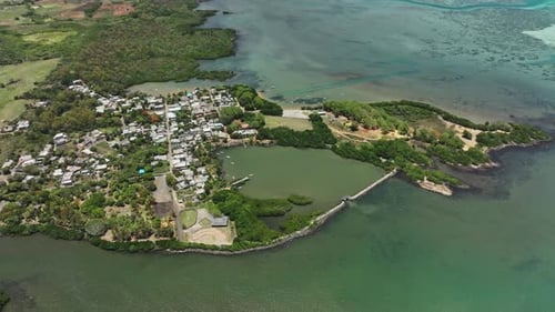 An aerial view of a small island in the middle of the ocean