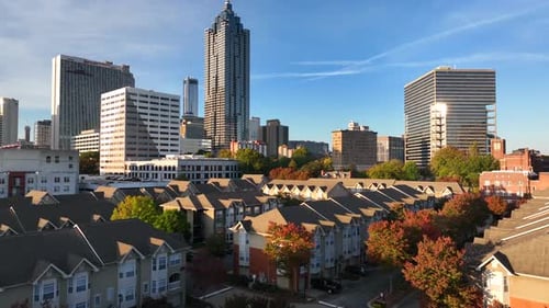 Residential housing, homes in downtown Atlanta Georgia during autumn. Aerial establishing shot at su