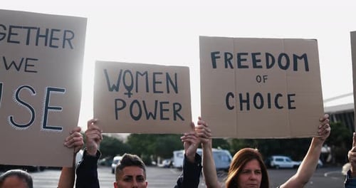 Multiracial women doing demonstration for female rights on city street - Feminism concept