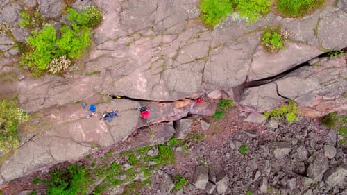 Rock Climbers Climb Down Rocky Cliff, Aerial Drone