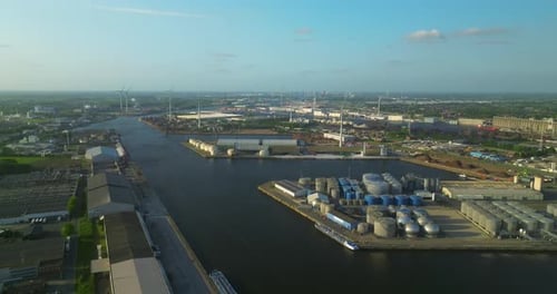Aerial View From a Drone of a Cargo Canal Ship Passes By Over the Canal on a Sunny Day Reflections
