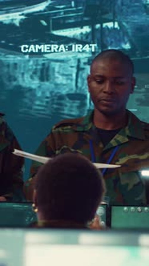 Men and woman work on computer screens