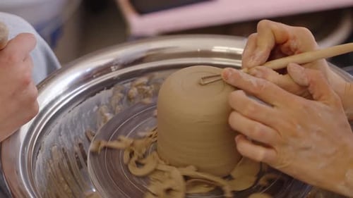 Creating a Clay Cup on a Pottery Wheel in an Art Studio