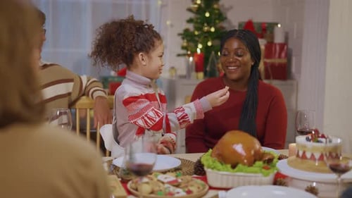 Festive Family Celebrates Christmas Together at Home