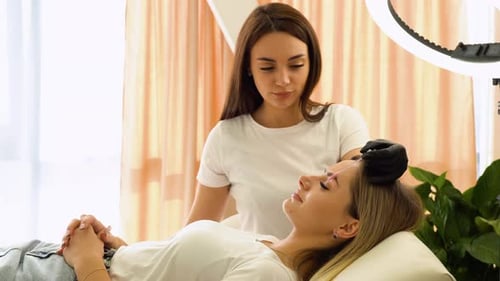 Woman Getting Eyebrows Shaped During a Beauty Treatment