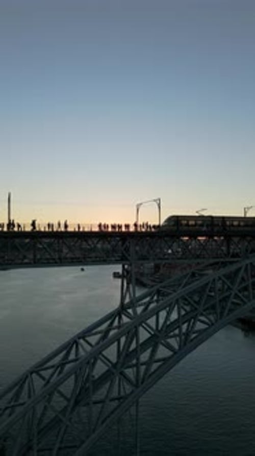 Porto City and Dom Luis I Bridge with Tram Aerial View Vertical Video