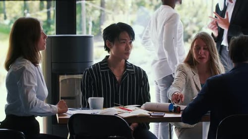 Young Handsome Serious 20s Chinese Manager Businessman is Stressed at Busy Modern Office Workplace