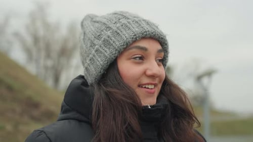 Cheerful Girl Walking Happily Young Female in Casual Wear Smiling in Park Wind Amusing Scene of