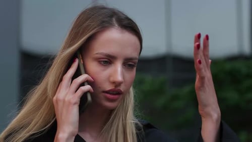 Head Shot Close Up Displeased Young Woman Looking at Smartphone Screen Outdoors Dissatisfied with