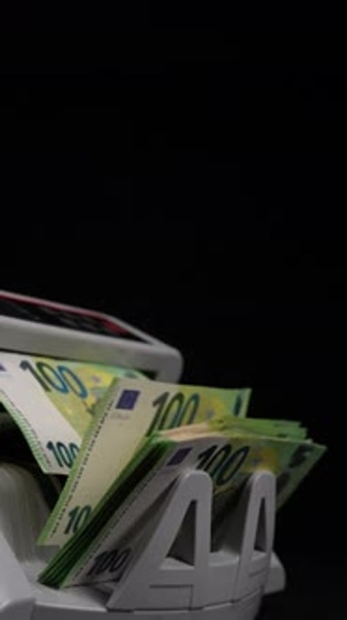 Currency Counter Counts Euro Banknotes Against Black Backdrop