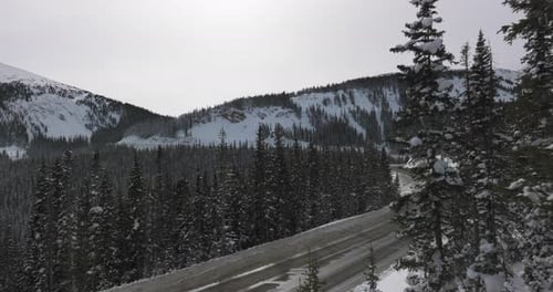 Aerial views of winding roads in the Colorado Rocky Mountains