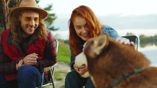 Couple and Dog Enjoying a Day Outdoors