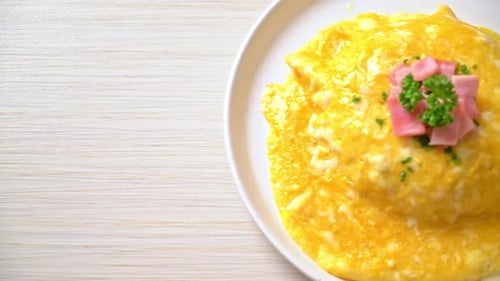 Delicious Omelet Garnished with Ham and Parsley