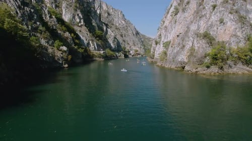 Scenic Lake Kayaking Between High Rocky Mountains