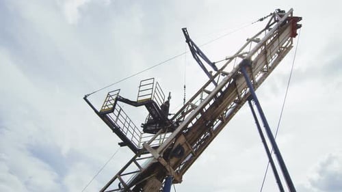 Courageous Employee Works on Geodetic Machine Top