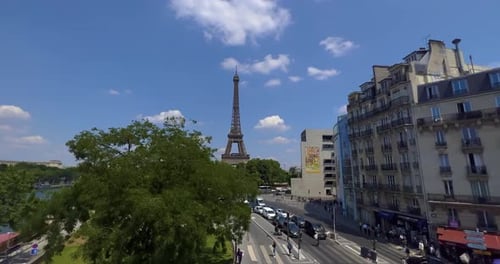 Aerial Drone Distant Sunset View of Tour Eiffel Tower and Seine River Bridge Traffic Cars Driving