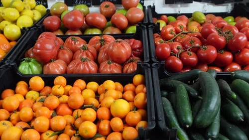 Various types of fruits and vegetables for sale at a market