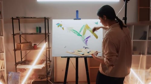 Woman Painting Colorful Abstract Art in Studio