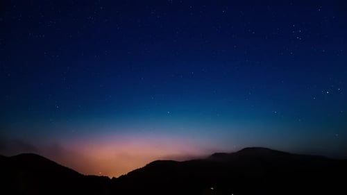 Star Time Lapse Over Mountains and Town