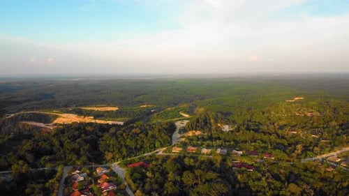 Amazing cinematic 4K sunset residential drone footage after deforestation issue consists of homes, r