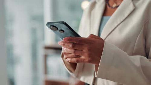 Black woman, hands and typing with phone for communication, chatting or texting at office