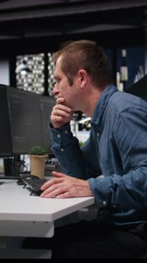 Man working on computer late at night