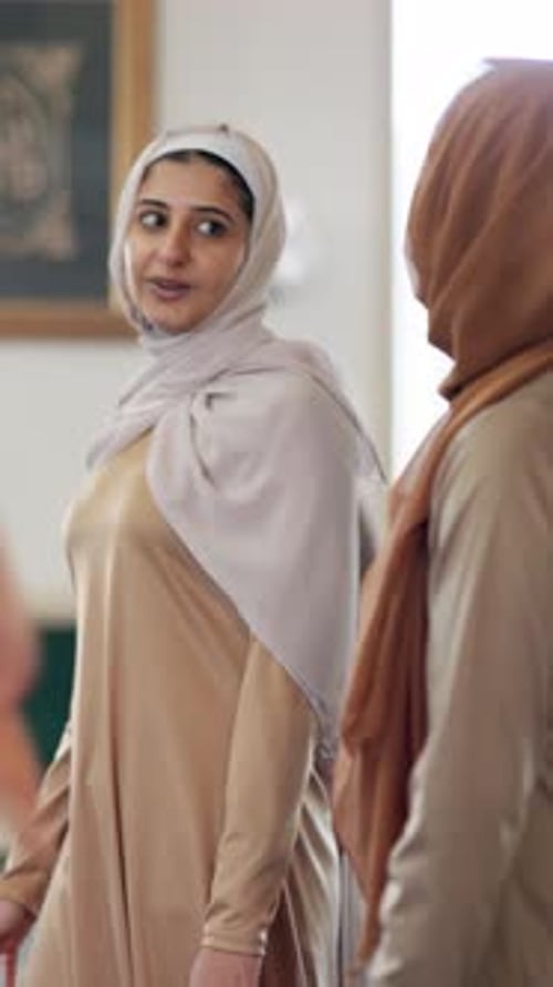 Muslim women, walking and talking with hijab in mosque for faith, belief
