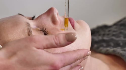 Woman Receives Facial Treatment, Close Up