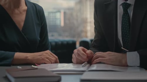 Businessman Consulting with Lawyer about Contract