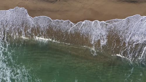 Flying Over a Tropical Paradise with Sea Waves Washing Sandy Beach. Aerial Drone View