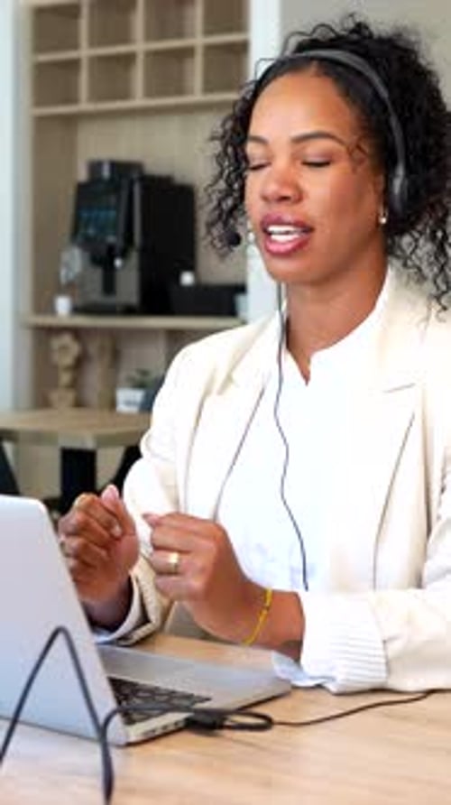 Confident businesswoman leading a video conference call in office