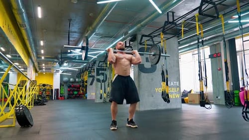 Hard Work Bodybuilder Raises Barbell