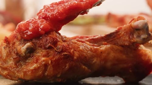Pouring Grill Bbq Piece of Chicken Kebab Over Red Tomato or Ketchup Sauce Closeup Eat Chicken Crispy