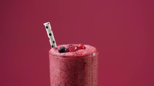 Berry Smoothie Close Up Against Red Background