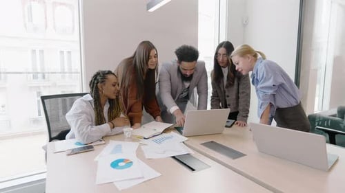 A Diverse Team Collaborating Effectively in a Modern Office Setting for Enhanced Productivity