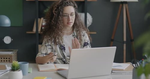 Woman Leading Online Meeting From Home Office