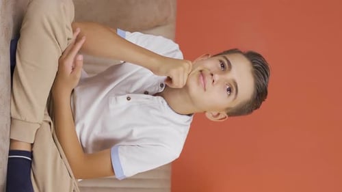 Vertical video of Thoughtful boy.