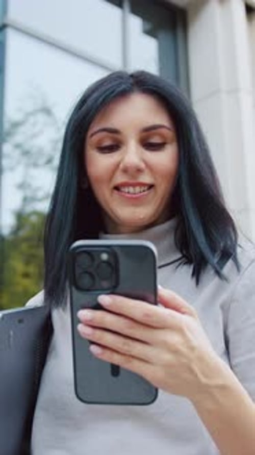 Portrait of Happy Smiling Brunette Girl Student Standing Next to the Building of the University