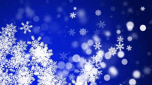 Falling Snowflakes and Bokeh on Blue Background