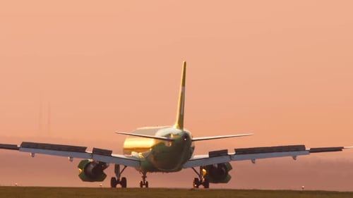 Airplane Braking at Sunset