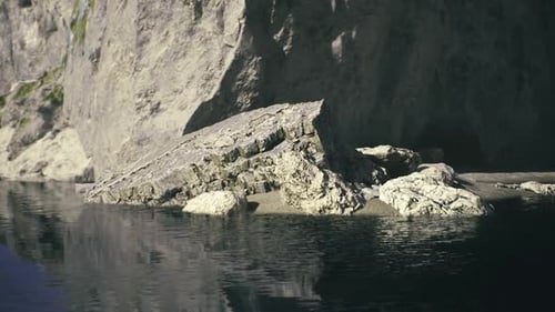 Steep Shadowed Relief Emphasizes Dramatic Coastal Rock Structures