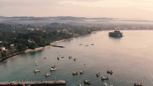 Weligama, Sri Lanka. Fishing Boats in Sri Lanka. Sri Lankan coast. Aerial cinematic view of Weligama