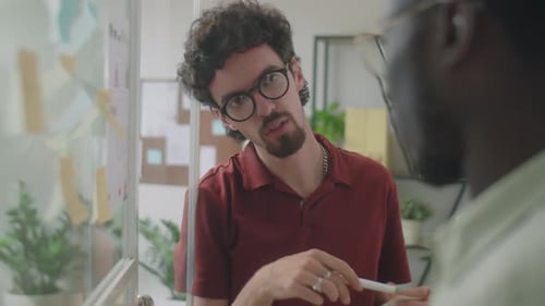 Men Collaborating on a Project in the Office