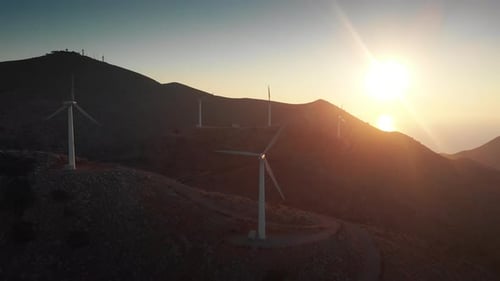 Modern power turbines on top of mountain against sky