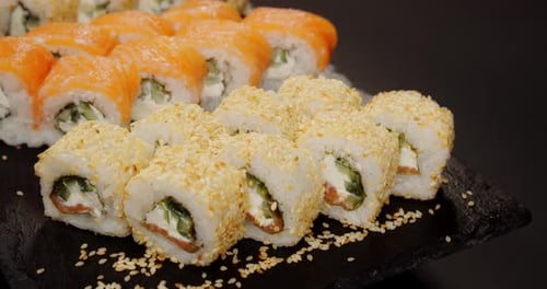 Closeup of Sushi Rolls with Salmon and Sesame Sushi Roll Concept