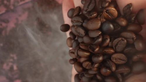 Pouring Coffee Beans in a Close Up Shot