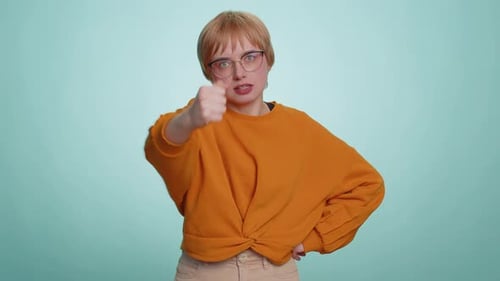 Serious Woman Miming Fighting and Punching