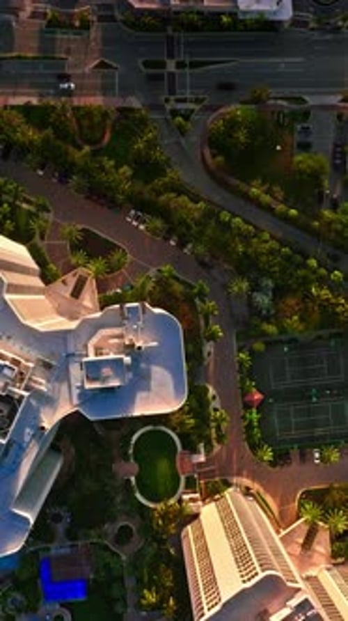 Aerial view of lush Miami landscape with tennis courts and palm trees