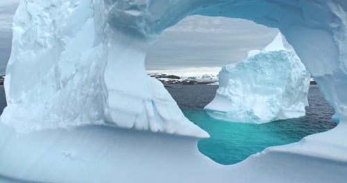 Large Iceberg Melting Hole Drifting Polar Ocean